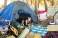 Couple talking while relaxing in tent