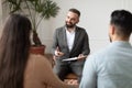 Couple talking at therapy session with male therapist Royalty Free Stock Photo