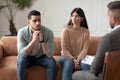 Couple talking at therapy session with professional male therapist Royalty Free Stock Photo