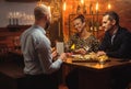 Couple talking to bartender behind bar counter in a cafe