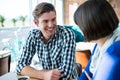 Couple talking to each other in coffee shop Royalty Free Stock Photo