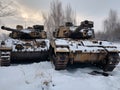 A couple of tanks that are sitting in the snow.