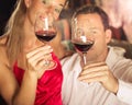 Couple tasting red wine in cellar at winetasting Royalty Free Stock Photo