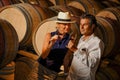 Couple tasting wine in a cellar Royalty Free Stock Photo