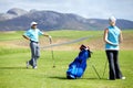 Couple, teamwork or golfer playing golf for fitness, workout or exercise together on green course field. Healthy people Royalty Free Stock Photo