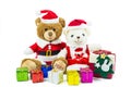 Couple teddy bear doll wearing santa set with many colorful gift boxes isolated on white background,Christmas day and New Year`s Royalty Free Stock Photo