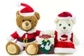 Couple teddy bear doll wearing santa set with many colorful red gift box isolated on white background,Christmas day and New Year` Royalty Free Stock Photo