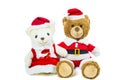 Couple teddy bear doll wearing santa set sitting isolated on white background,Christmas day and New Year`s gifts Royalty Free Stock Photo