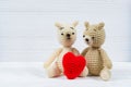 Couple teddy bear with red heart crochet knitting handmade, love and valentine concept.