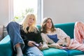 Couple of teenage friends playing with video game console Royalty Free Stock Photo