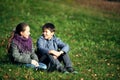 Couple of teenagers meet romantically outdoors.