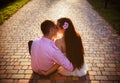 Couple of teenagers sit in street together Royalty Free Stock Photo