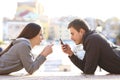 Couple of teens obsessed with smart phones