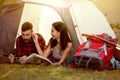 Couple in tent enjoying camping in nature