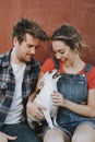 Couple with their adopted Chihuahua dog