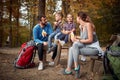 A couple and their children having a break of hiking in the forest Royalty Free Stock Photo