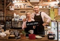 Couple in their new cafe, proud news business owners Royalty Free Stock Photo