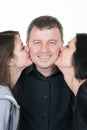 Couple With Their Teenage Daughter kissing Royalty Free Stock Photo