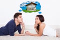 Couple thinking of dream house Royalty Free Stock Photo