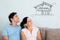 Smiling Couple Thinking Of Getting Their New House Royalty Free Stock Photo