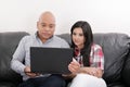 Couple thinking and looking at a laptop computer Royalty Free Stock Photo