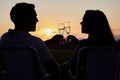 Couple, toast and sunset love of people silhouette with champagne glasses outdoor. Happy, alcohol and valentines day Royalty Free Stock Photo