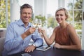 Couple toasting glasses of wine in restaurant Royalty Free Stock Photo