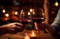 couple toasting wine glasses at a dinner table Royalty Free Stock Photo