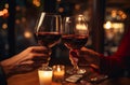 couple toasting wine glasses at a dinner table Royalty Free Stock Photo