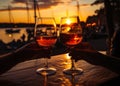 Couple toasting wine glasses at sunset. Two wine glasses clinking over the sunset Royalty Free Stock Photo