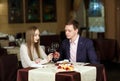 Couple toasting wineglasses in a luxury restaurant. Royalty Free Stock Photo