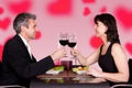 Couple toasting wineglasses at table in restaurant Royalty Free Stock Photo