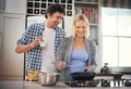 Couple, together and cooking in kitchen for breakfast with happiness, pancakes and healthy eating. Happy man, woman and Royalty Free Stock Photo