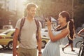 Couple, tourism and photography in street for travel, sightseeing and happiness on holiday or vacation in Brazil. Camera Royalty Free Stock Photo