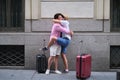 A couple of tourist hugging when then re-encounter after long time