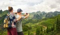 Couple tourist makes photo karst mountains.