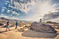 Couple of tourist near ancient stone painting