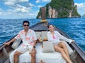 Couple  tourist in private longtail boat trip to island with exotic food picnic, Krabi, Thailand. landmark, destination, Asia Royalty Free Stock Photo