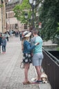 Couple of tourist taking a selfy picture on bridge in little Venise quarter in Colmar