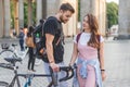 couple of tourists with backpacks and bicycle at Pariser Platz