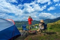 Couple tourists enjoying in the camping on mountains, Traveler take a photo at viewpoint