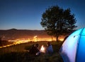 Couple tourists resting at night camping under stars Royalty Free Stock Photo