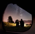 Couple tourists resting at night camping under stars Royalty Free Stock Photo