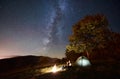 Couple tourists resting at night camping under stars Royalty Free Stock Photo