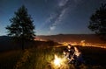 Couple tourists resting at night camping under stars Royalty Free Stock Photo