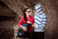 Couple of tourists in the rocky grot Royalty Free Stock Photo