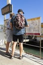 Couple of tourists study map of Venice