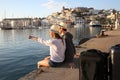 Couple of tourists at sunset admiring view