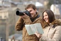 Couple of tourists taking photos with a dslr camera