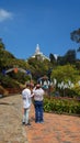 Couple of tourists taking pictures on the way to the church on top of Mount Monserrate